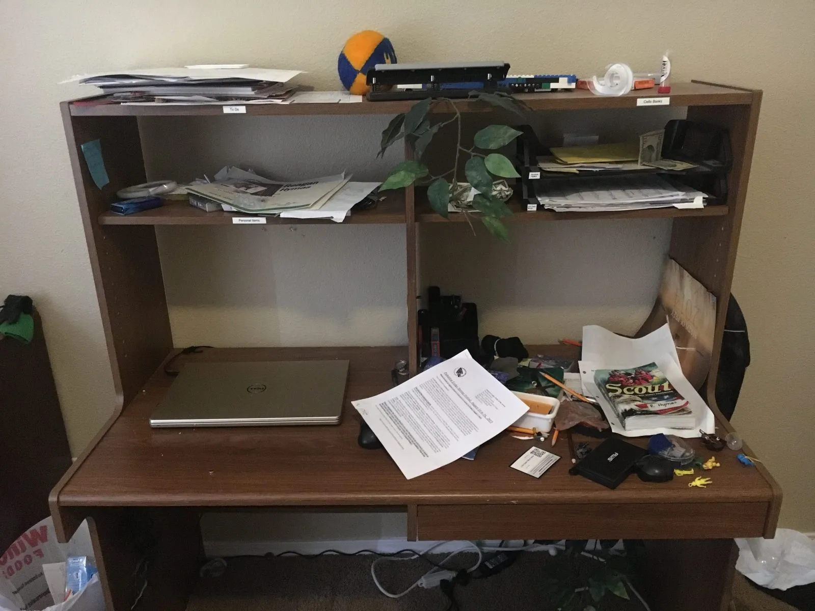 A cluttered student homework desk photographed for a study-skills class